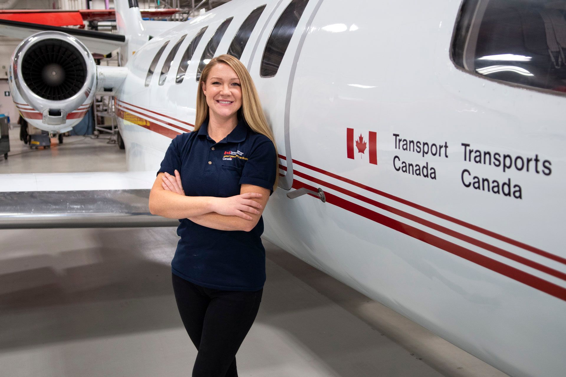 Michelle Maye, from Transport Canada, poses in front of the Transport Canada Citation