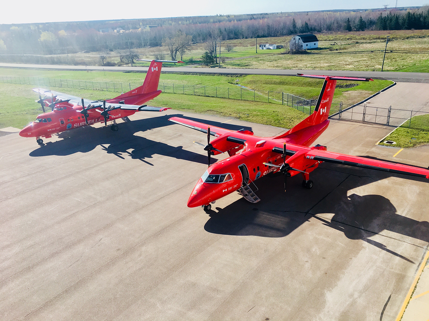two NASP planes parked side by side in an airfield in Moncton, NB.