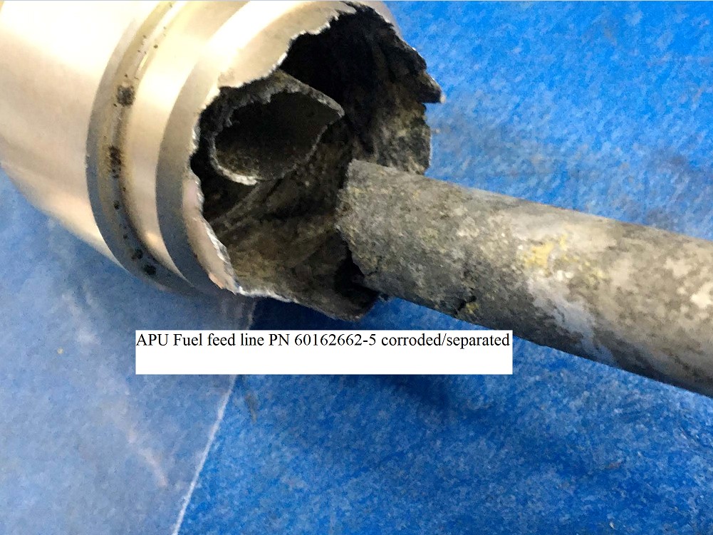 Text on picture: APU Fuel feed line PN 60162662-5 corroded/separated