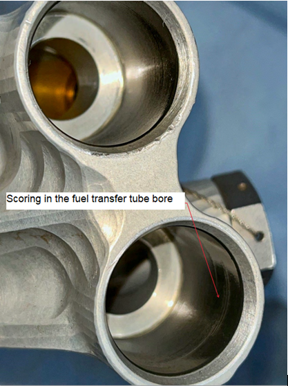 Picture 2: Scored transfer tube bores. Text in the picture: Scoring in the fuel transfer tube bore