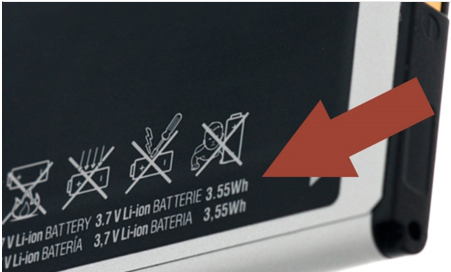 Photo of a lithium battery label and a red arrow pointing to the battery’s Wh rating.